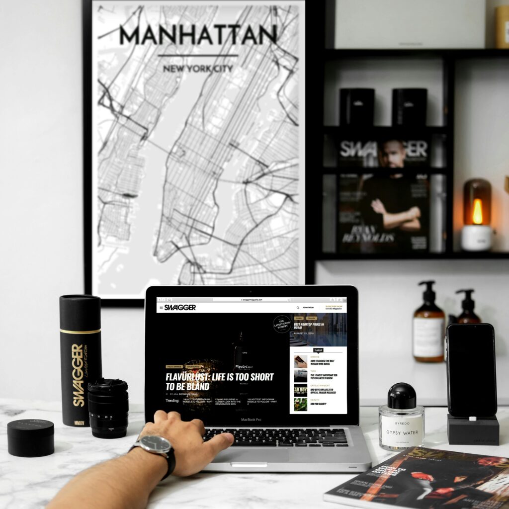 Chic workspace featuring a MacBook, stylish decor, and Manhattan map art.